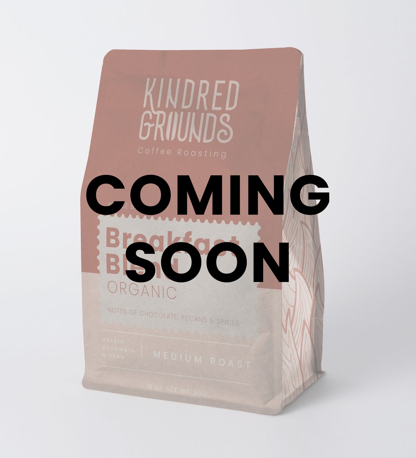 Coffee bag with 'Kindred Grounds' branding and 'Coming Soon' text on a white background